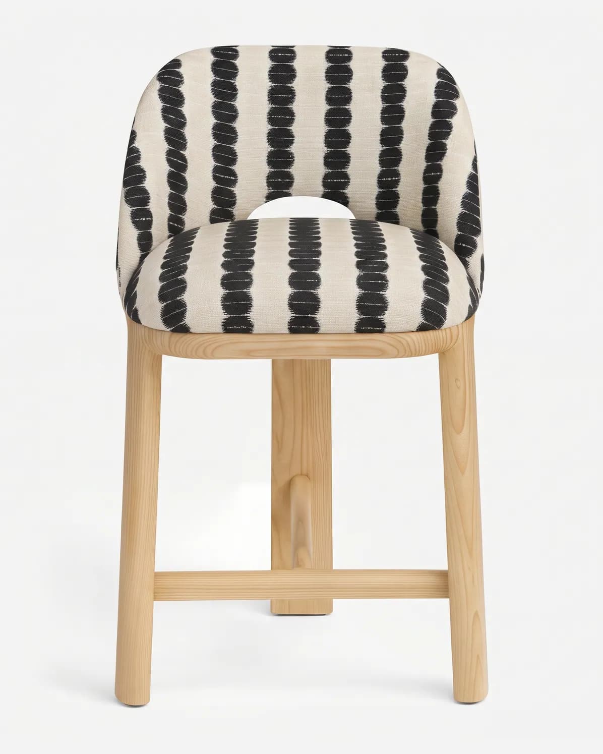 Eden Barstool barstool — ash wood frame with four round legs joined by stretchers, upholstered in pattern fabric, with a curved back that has…