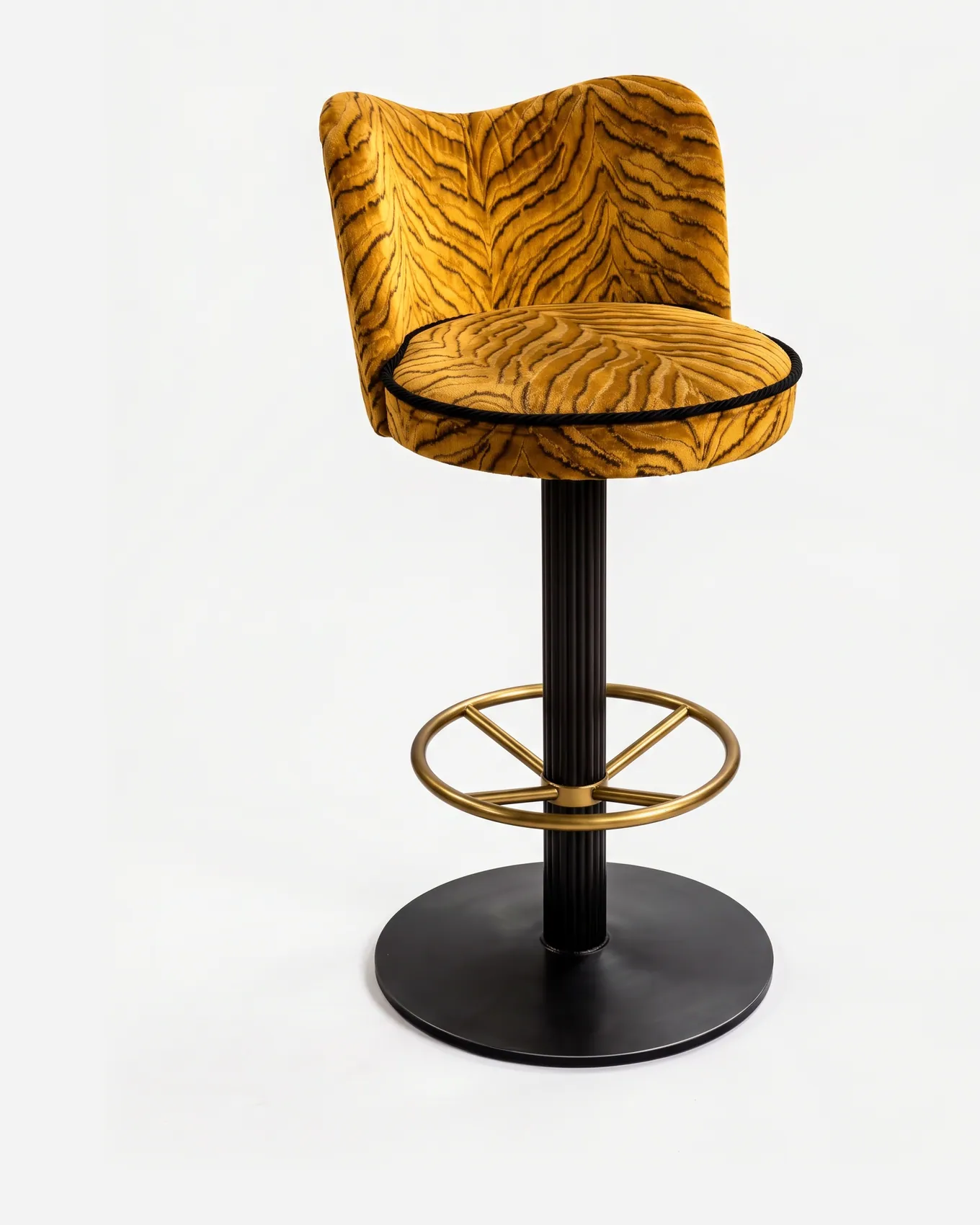 Panthera Barstool barstool — fluted column and round base in electroplated matte black with a footrest ring in electroplated brass-aged, upholster…