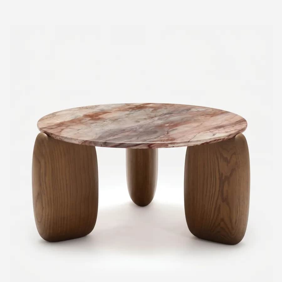 Neris Coffee Table coffee table — ash wood in a walnut stain forms three oversized, rounded legs with a visible flowing grain, beneath a round marble t…