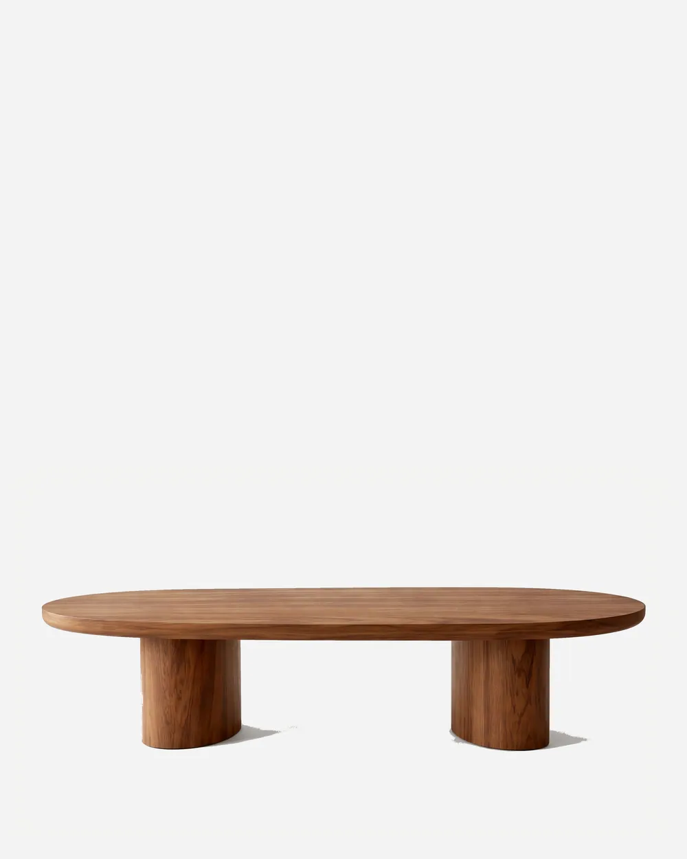 Quinn Coffee Table coffee table — iroko wood in a walnut stain throughout, with a long rounded-end racetrack top resting on two oval pedestal legs set…
