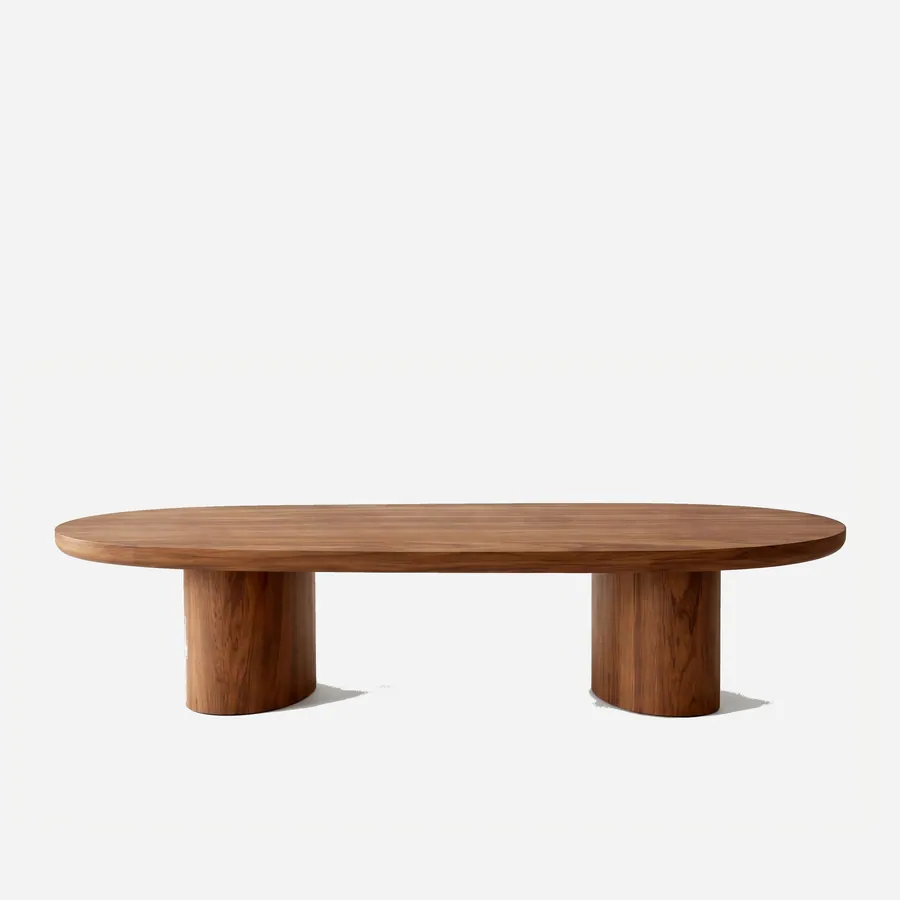 Quinn Coffee Table coffee table — iroko wood in a walnut stain throughout, with a long rounded-end racetrack top resting on two oval pedestal legs set…