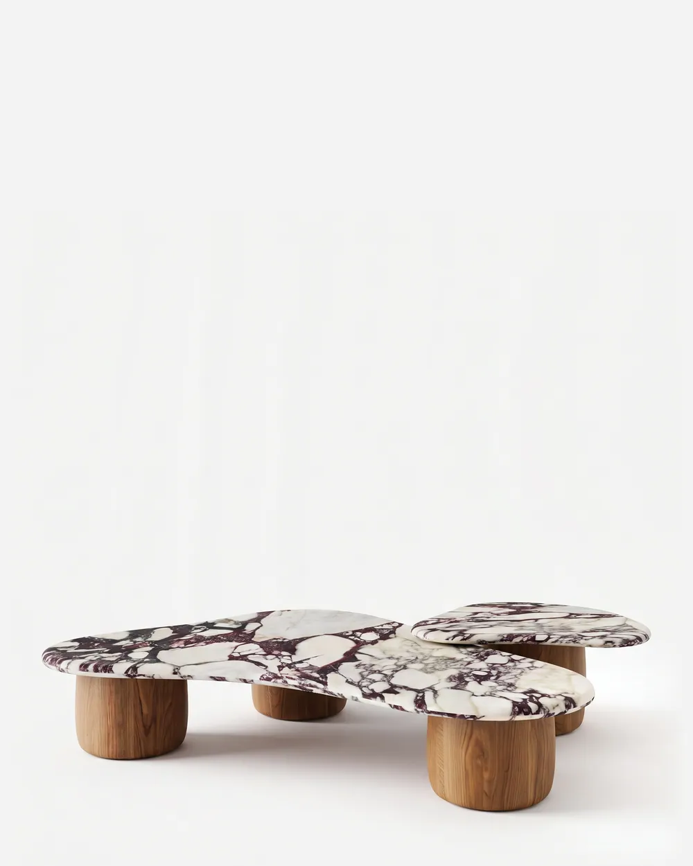 Tallis Coffee Table coffee table — walnut wood feet in a natural finish, short and rounded, carrying two pebble-shaped tops in Calacatta Viola marble se…