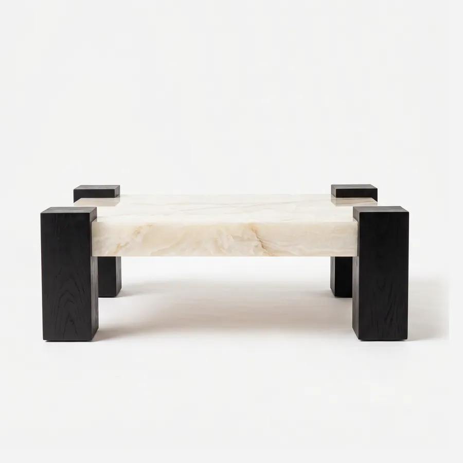 Voss Coffee Table coffee table — square-section corner posts in red oak open grain in a charcoal stain, rising slightly above a thick rectangular top…