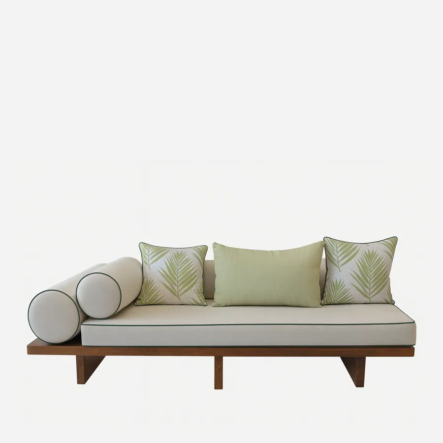 Terra daybed — iroko wood platform frame on slab legs, topped with a full-length mattress in plain fabric with contrast piping, two…