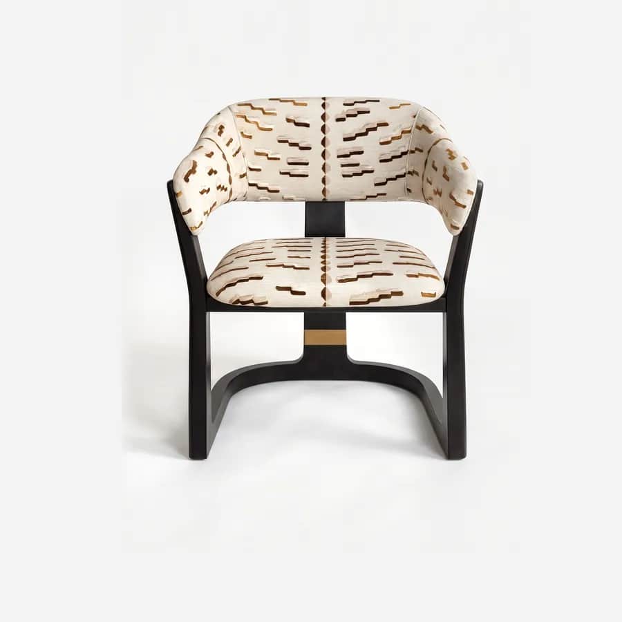 Helsinki Dining Chair dining chair — dark-stained solid wood frame with a patterned fabric upholstered seat and curved backrest, finished with a metal acc…