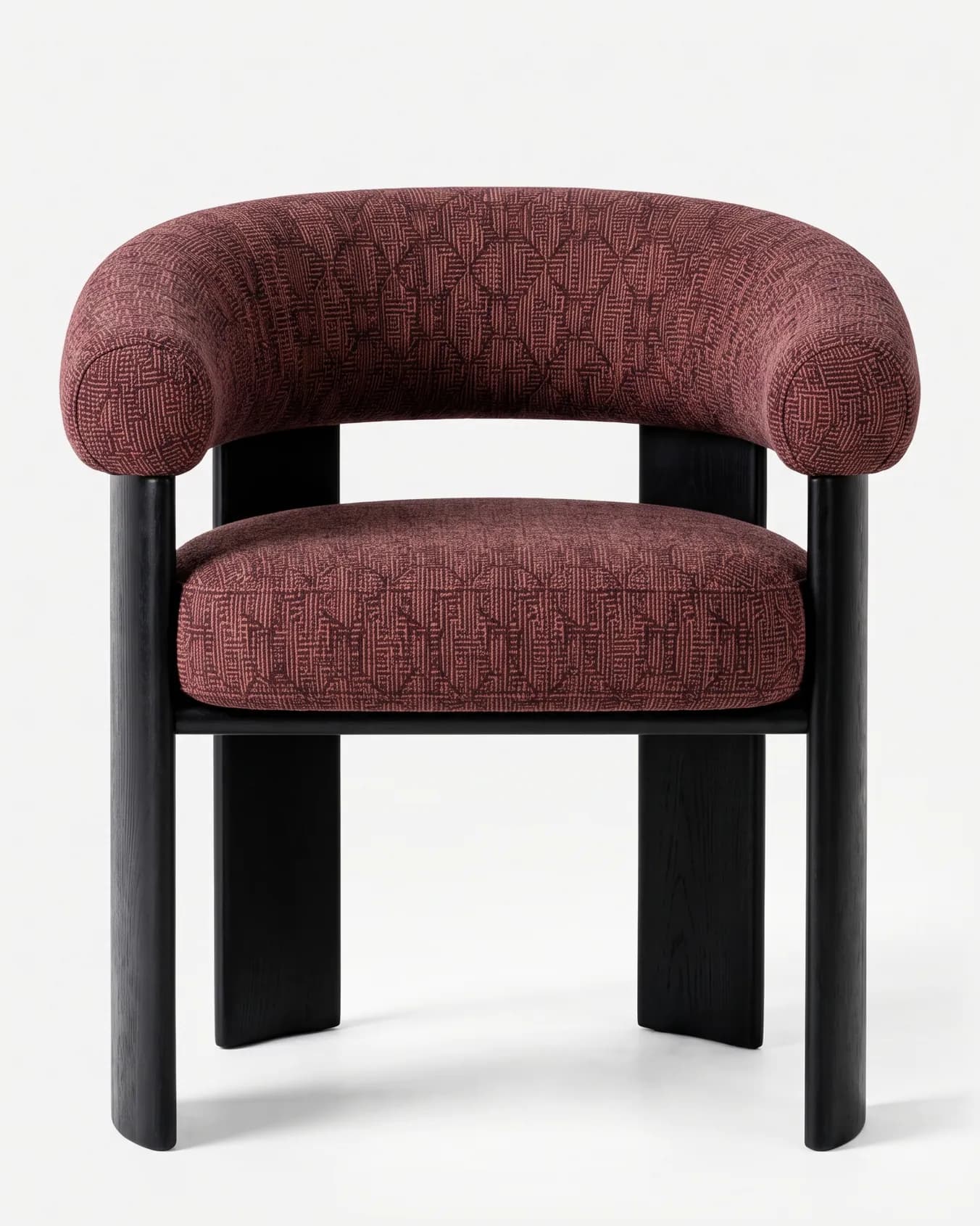 Nuvia Dining Chair dining chair — red oak open grain frame in a charcoal stain, upholstered in pattern fabric, with broad plank legs and a thick rounde…
