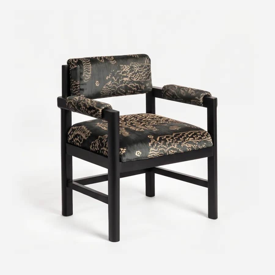 Savel Dining Chair dining chair — beech wood frame in a charcoal stain, upholstered in pattern velvet, with round legs and H-stretchers, an upholstered…