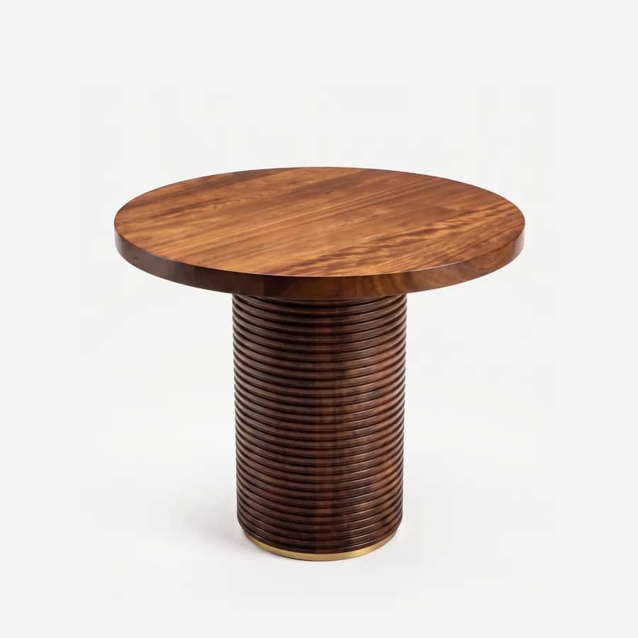 Dara Dining Table dining table — iroko wood in a walnut stain, with a figured round top on a broad drum pedestal of horizontal ribs, finished at the f…