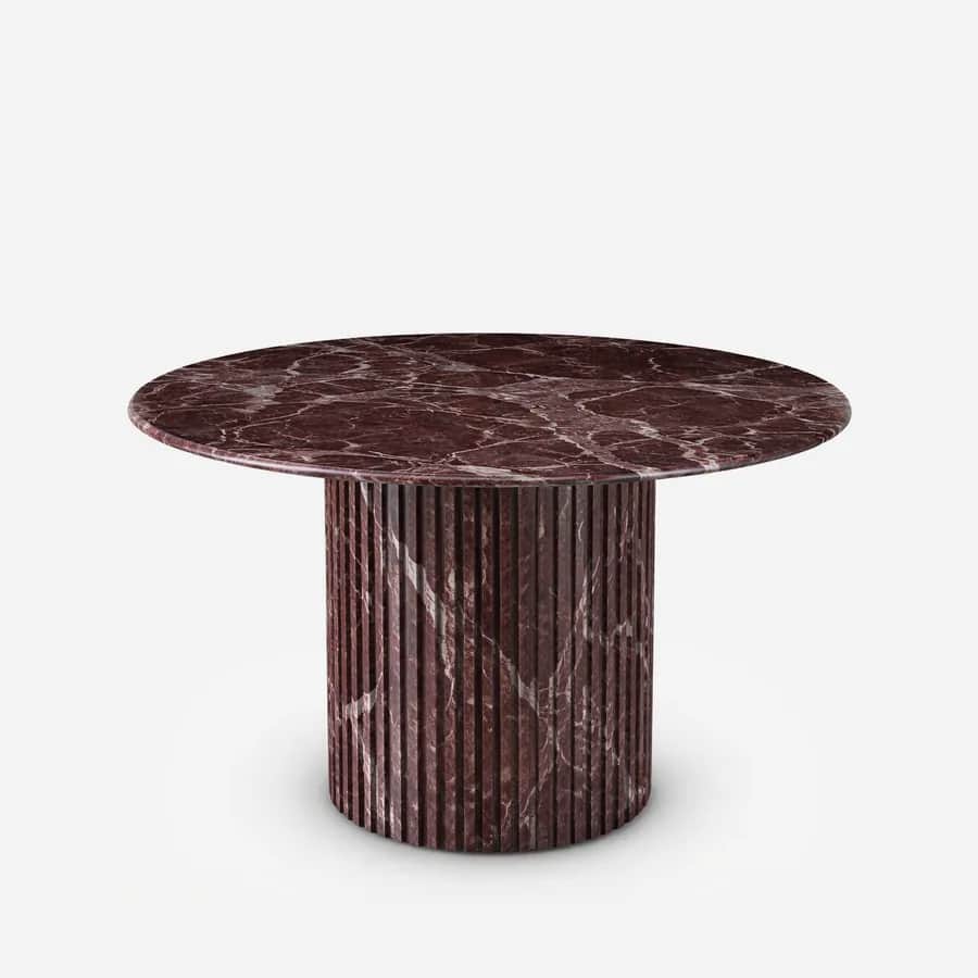 Isamu Dining Table dining table — rosso Levanto marble throughout, with a round top set on a fluted column base in the same stone, giving the table a s…
