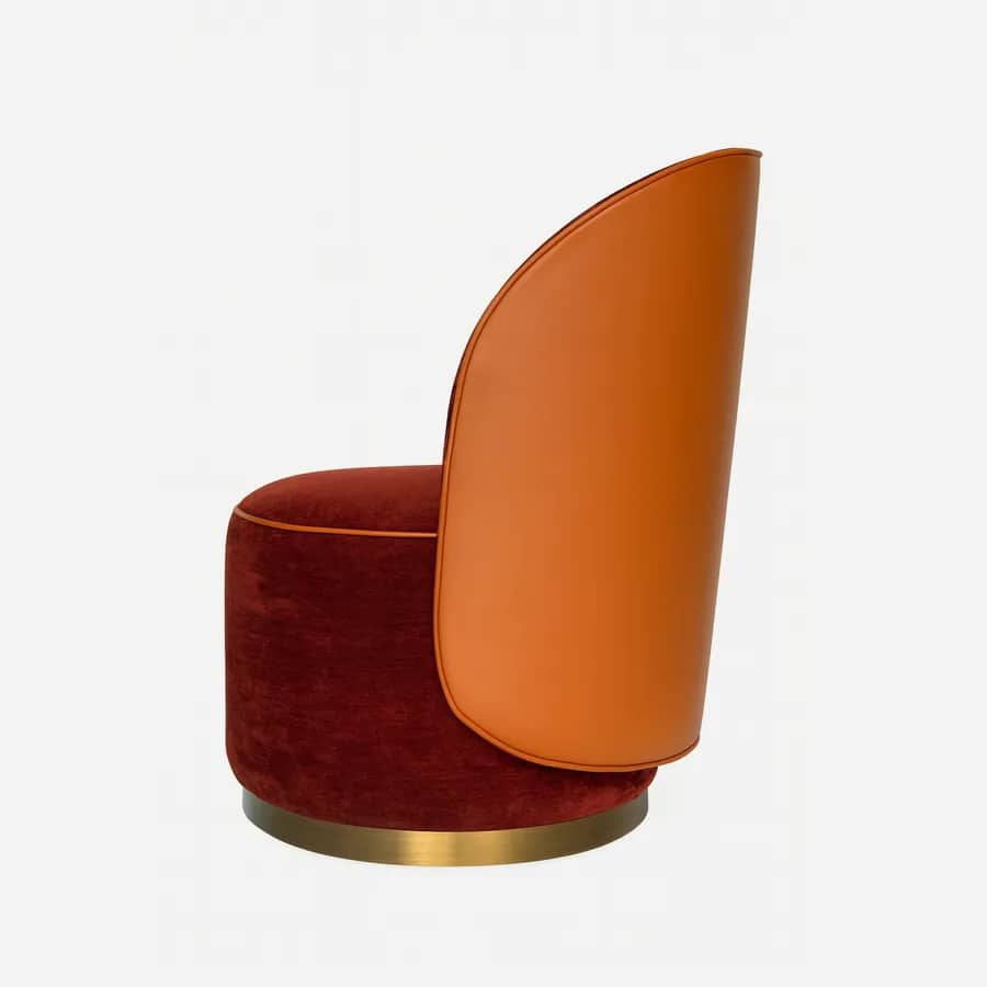 Talora Lounge Chair lounge chair — fully upholstered with piping detail, featuring a leather outer back and a fabric seat and inner back