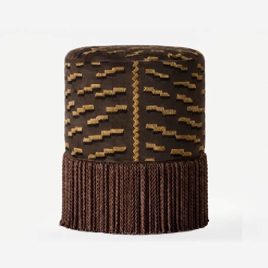 Lumo Pouf pouf — cylindrical, fully upholstered pouf in pattern velvet with a raised geometric motif and a central zigzag trim, finish…