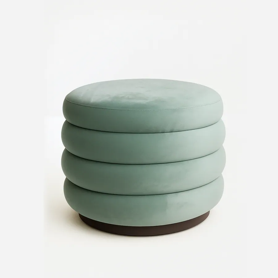 Miro Pouf pouf — a fully upholstered pouf with layered, rounded cushioning and a solid base