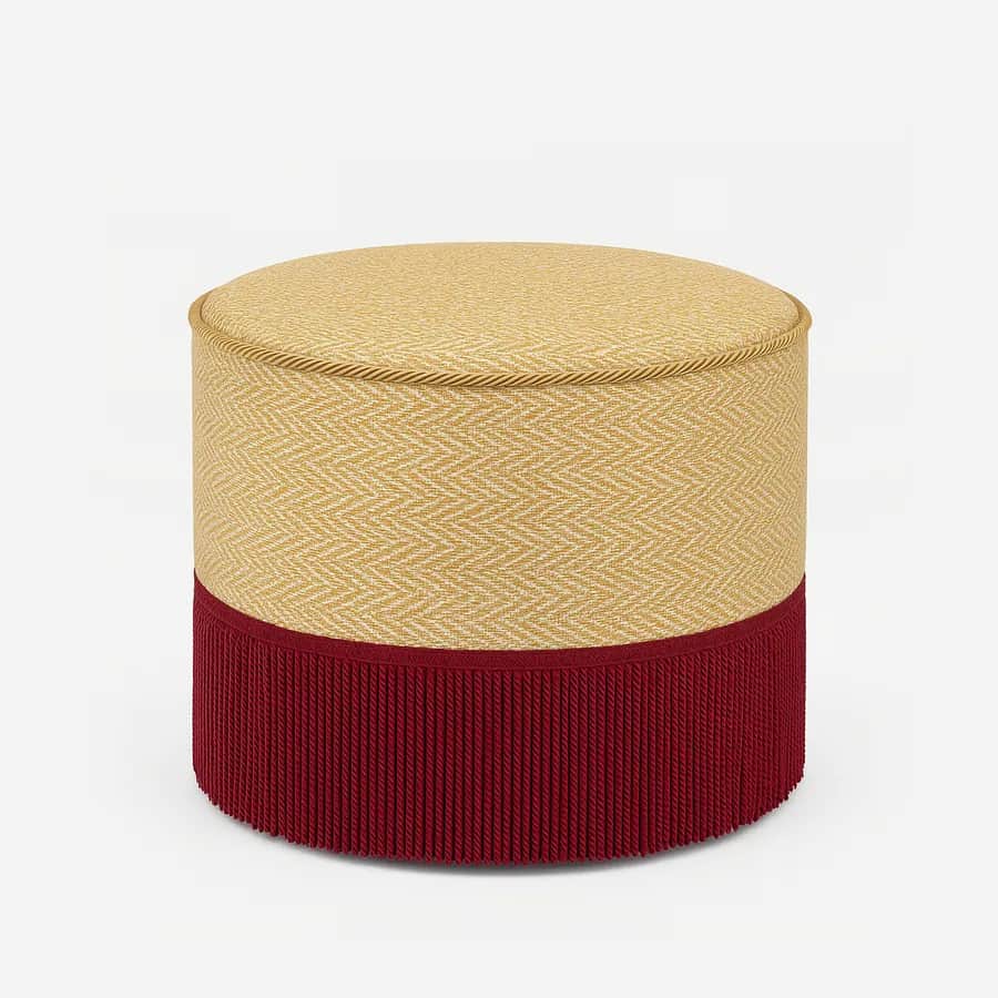 Suri Pouf pouf — the pouf features an upholstered shell built on a plywood structure with fringe detailing and is fitted with glides