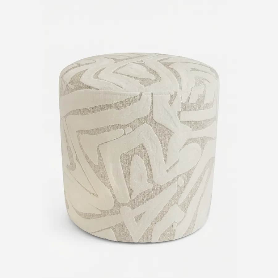 Tova Pouf pouf — fully upholstered in a patterned fabric for added character, completed with a rubber buffer to protect surfaces