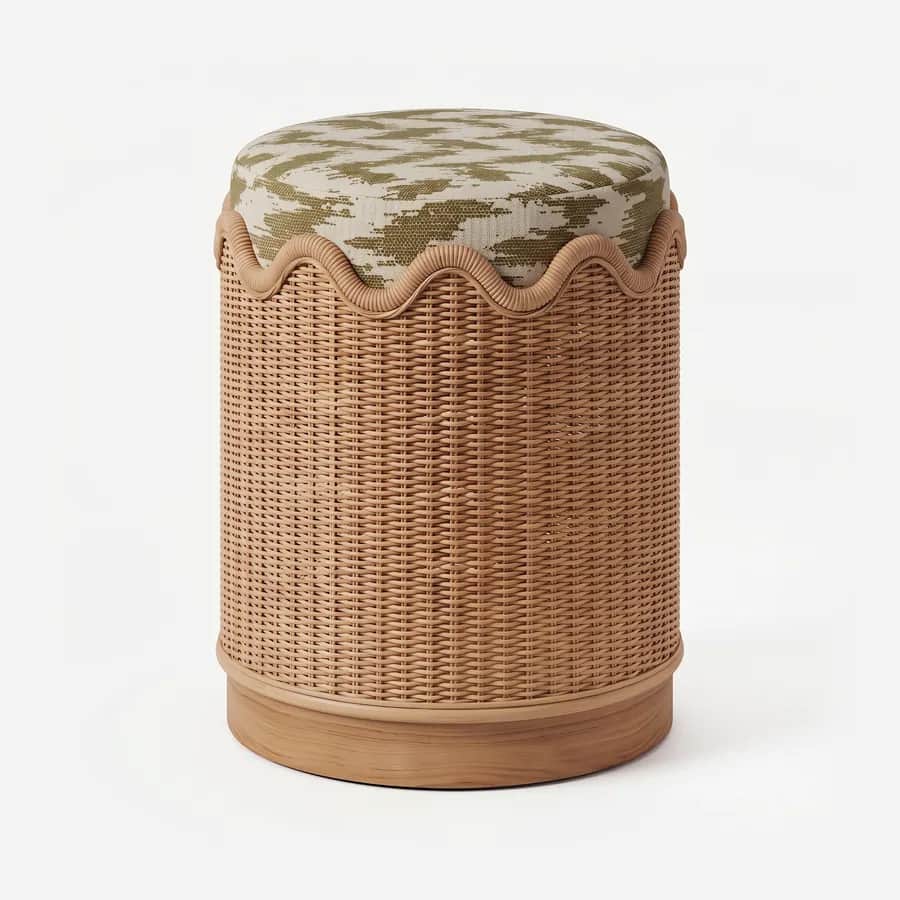 Drift Pouf pouf — woven rattan drum with a scalloped rattan rim, set on an iroko wood plinth and topped with a seat cushion upholstered…
