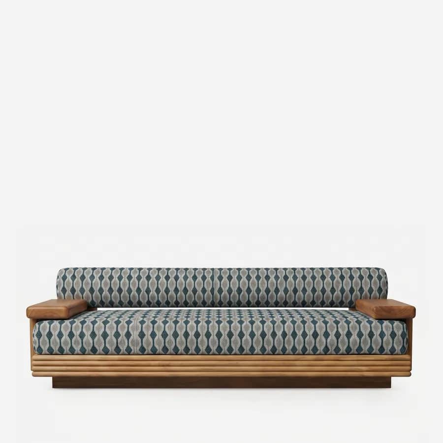 Calloway Sofa sofa — low iroko wood base with reeded horizontal banding and short block armrests, with a long seat cushion and a single bo…