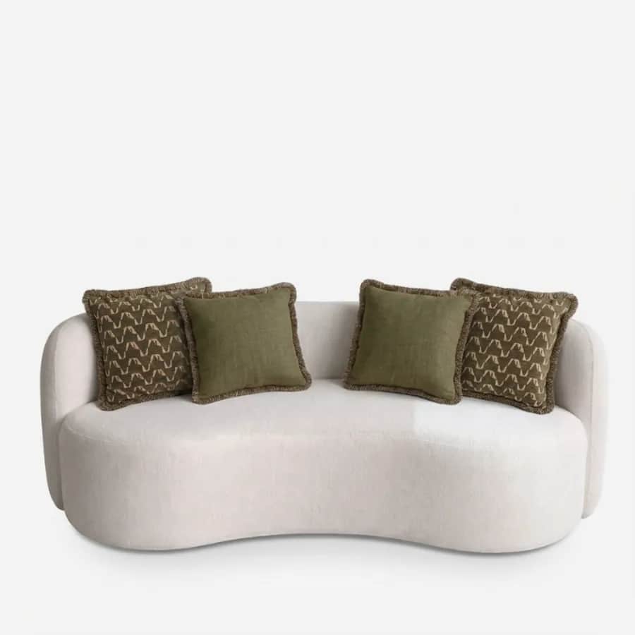 Ember Sofa sofa — curved sofa fully upholstered in a textured bouclé fabric, with a rounded back wrapping into low sides, a deep kidney…