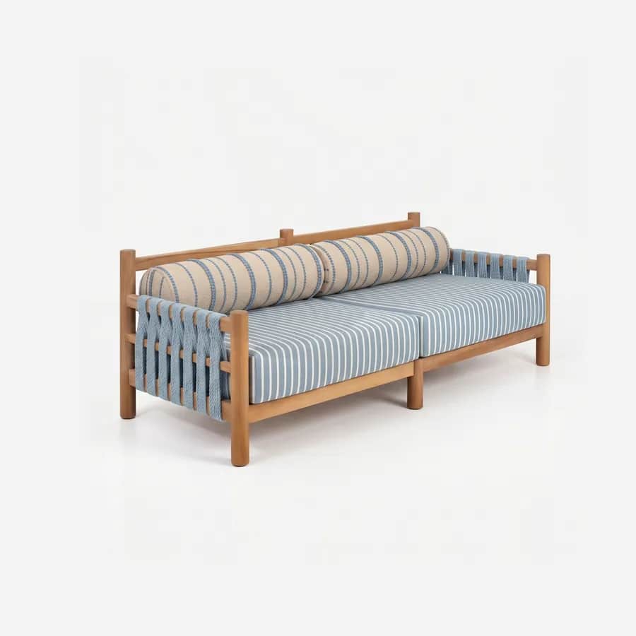 Magnus Sofa sofa — teak wood post-and-rail frame with woven rope strap panels to the back and sides, with loose striped seat cushions an…