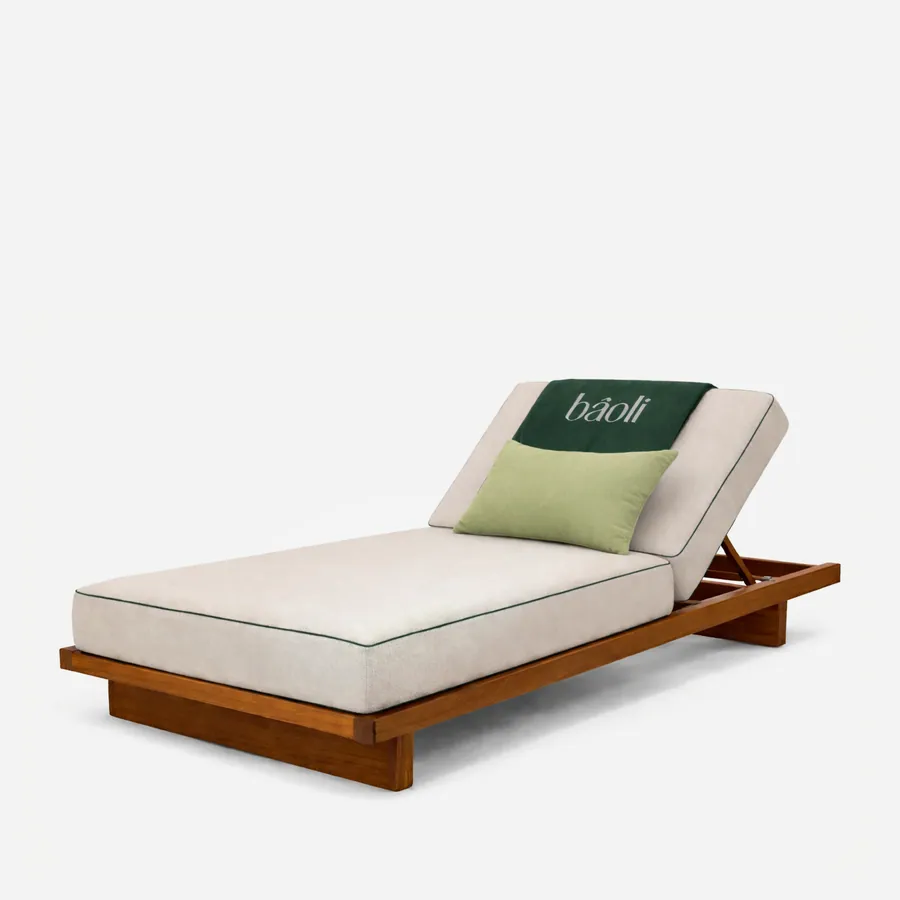 Mykonos sun lounger — iroko wood frame on a low platform base with a full-length mattress in plain fabric; the backrest section lifts to ad…