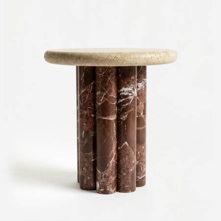 Liora Side Table side table — beige travertine round top with a softly rounded edge, resting on a base of clustered cylindrical columns in Rosso Le…