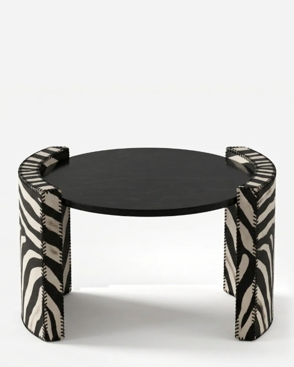 Neyra Side Table side table — nero Marquina marble round top carried on two curved, wraparound side supports covered in zebra-pattern leather with…