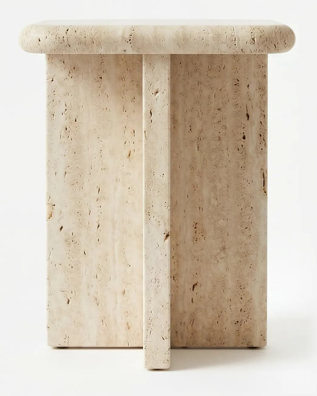 Nilo Side Table side table — made entirely in beige travertine, with a square top with softly rounded edges and corners resting on a cross-shaped…