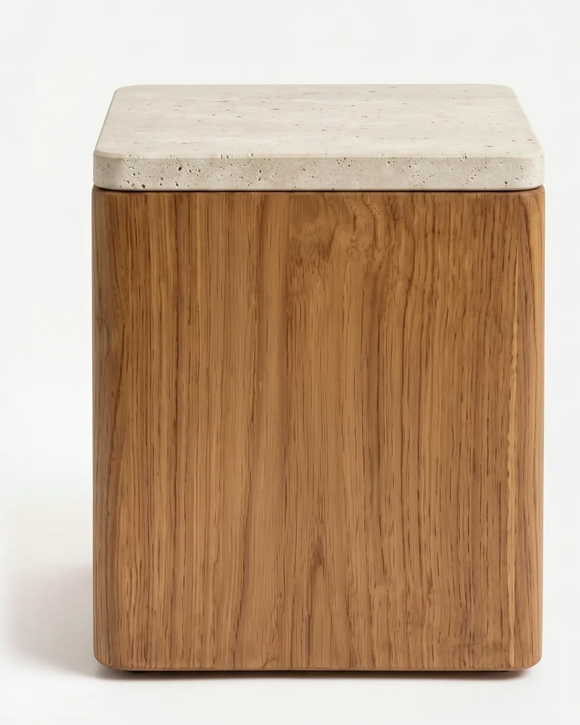 Taro Side Table side table — teak wood block body with softly rounded vertical edges, capped by a slightly overhanging square top in beige travertine