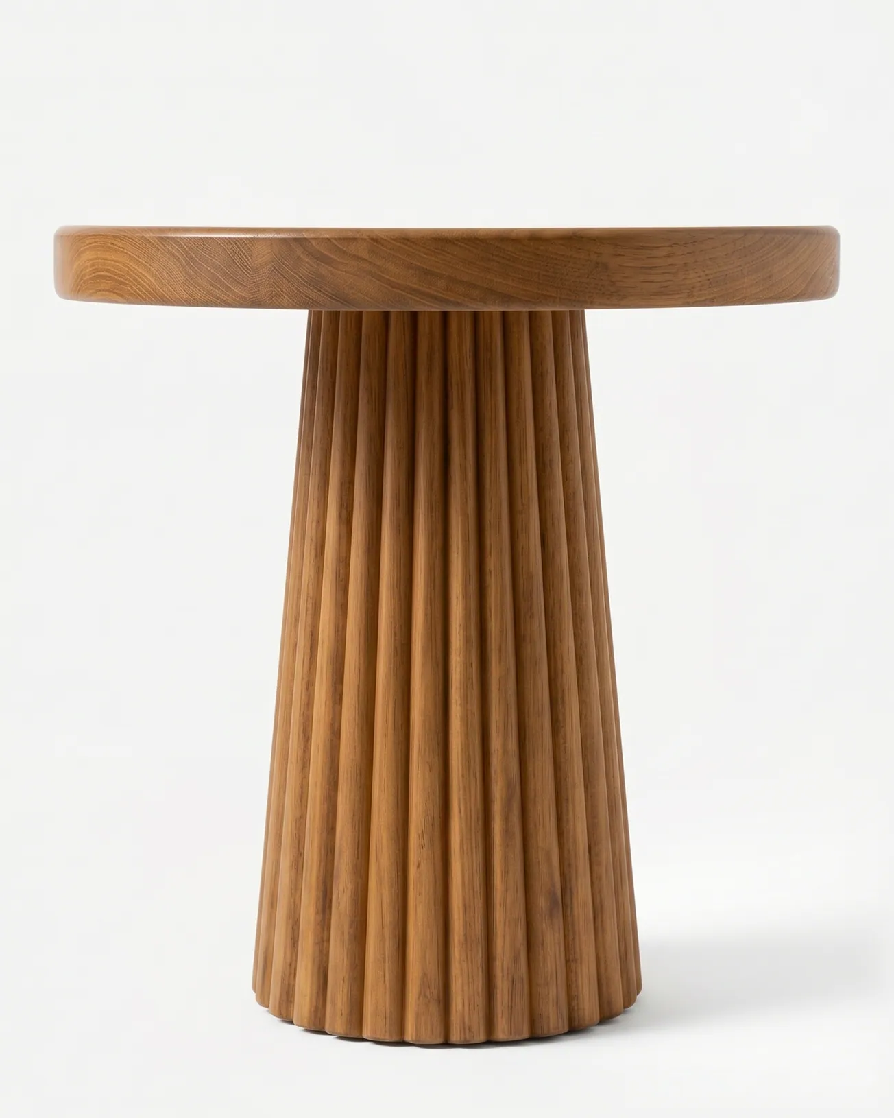 Zeno Side Table side table — iroko wood throughout, with a thick round top on a flared pedestal of vertical fluted staves that widens towards the…