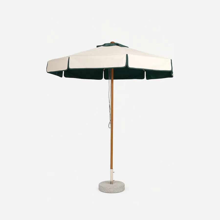 Siro umbrella — iroko wood centre pole carrying a round plain fabric canopy in cream with a contrast scalloped green valance, standin…