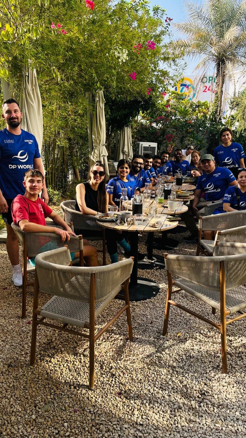 The team at a garden breakfast after the Dubai ride