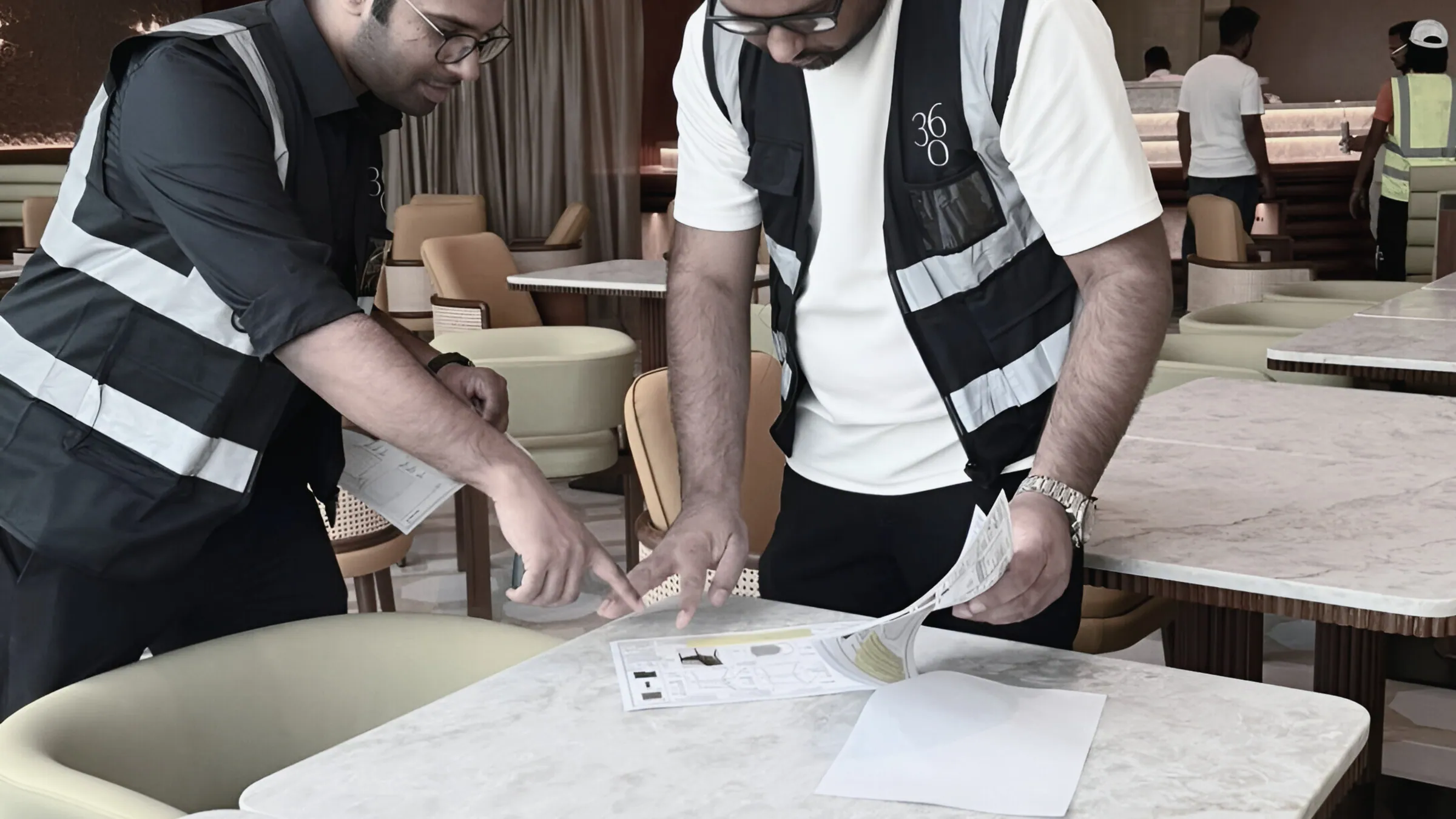 The Interior Three Sixty team checking a specification on site